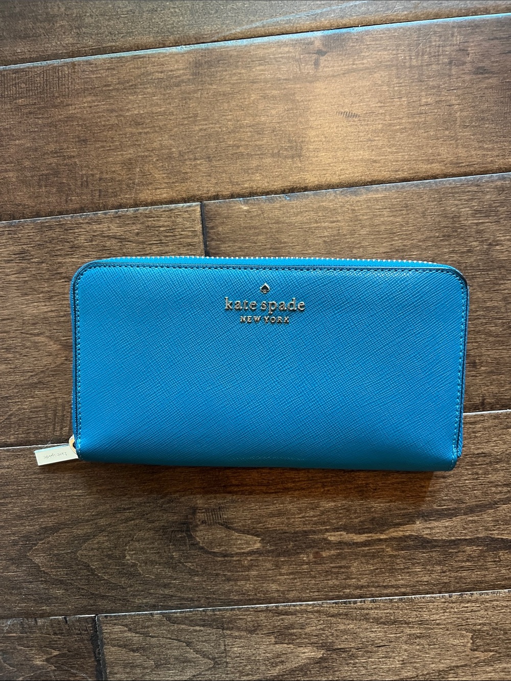 kate spade teal zip-around wallet with gold logo